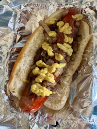 a hot dog wrapped in foil