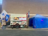 a food truck is parked in front of a store