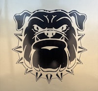 a black and white bulldog head sticker on the side of a truck
