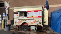 a food truck parked in front of a building